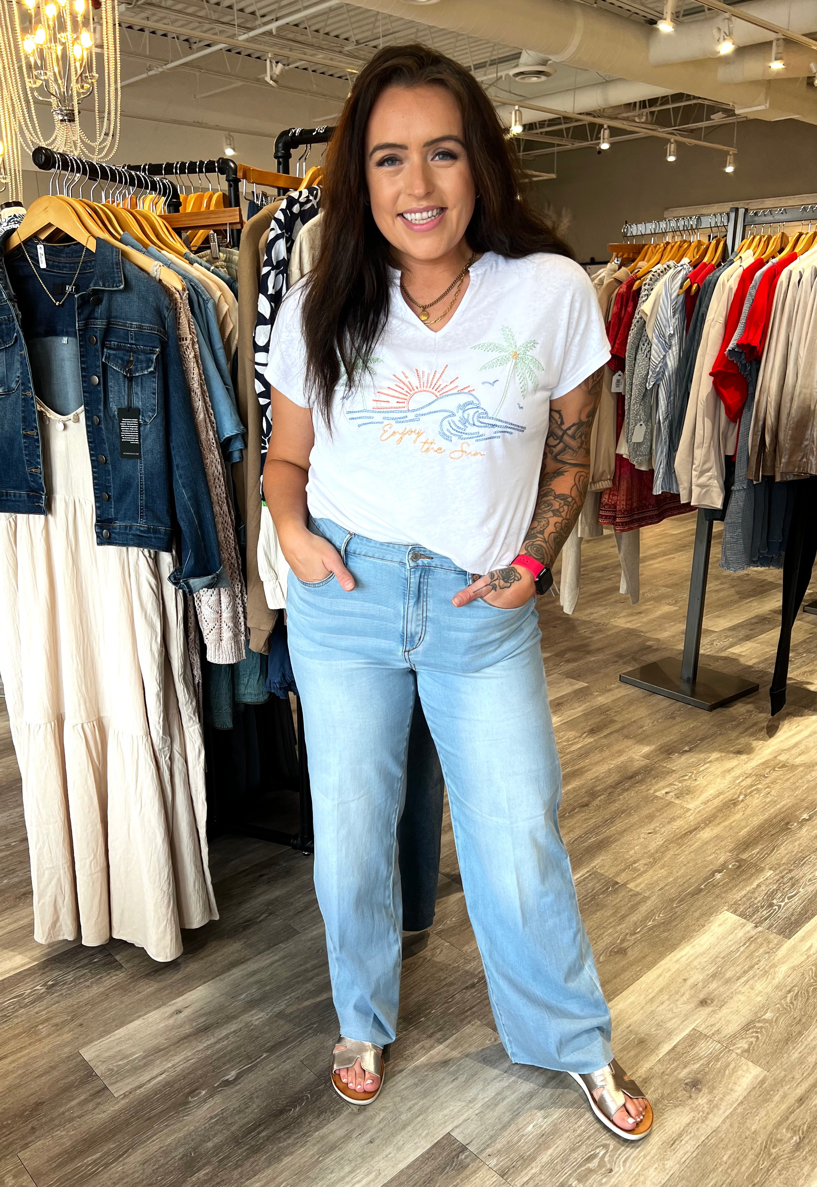 Step up your denim game with this pair of wide-leg jeans, featuring a trouser-inspired crease for a touch of sophistication. Crafted from limitless stretch denim, they provide all-day comfort and flexibility, while the figure-hugging upper fit flatters your shape. Five pockets add practical functionality to this stylish design.