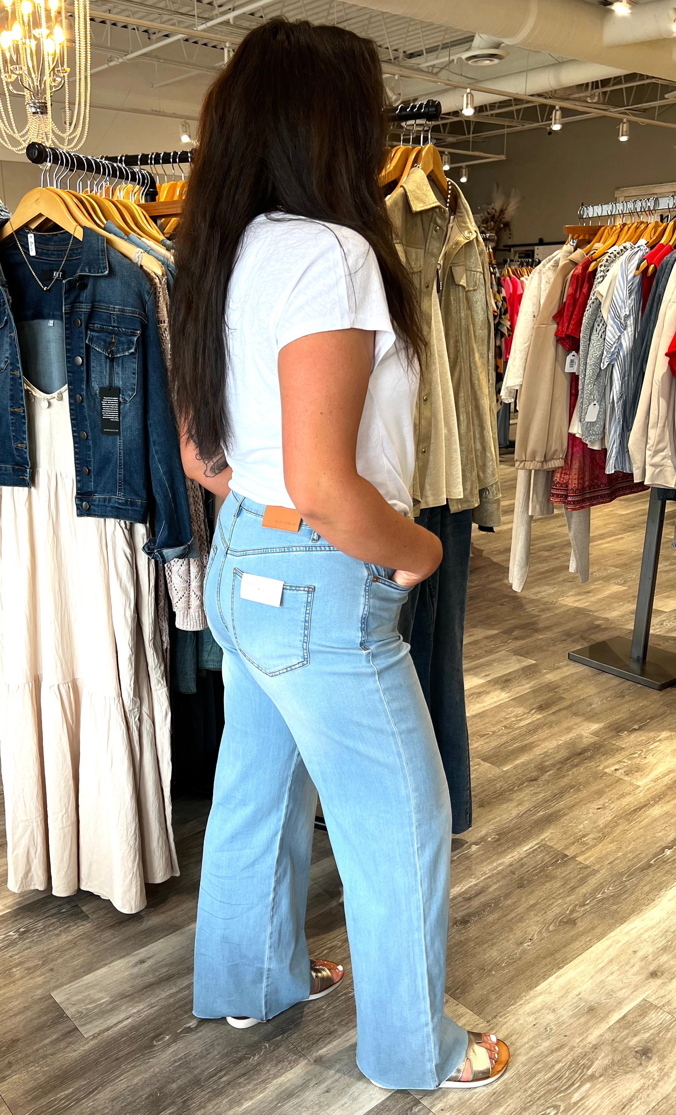 Step up your denim game with this pair of wide-leg jeans, featuring a trouser-inspired crease for a touch of sophistication. Crafted from limitless stretch denim, they provide all-day comfort and flexibility, while the figure-hugging upper fit flatters your shape. Five pockets add practical functionality to this stylish design.