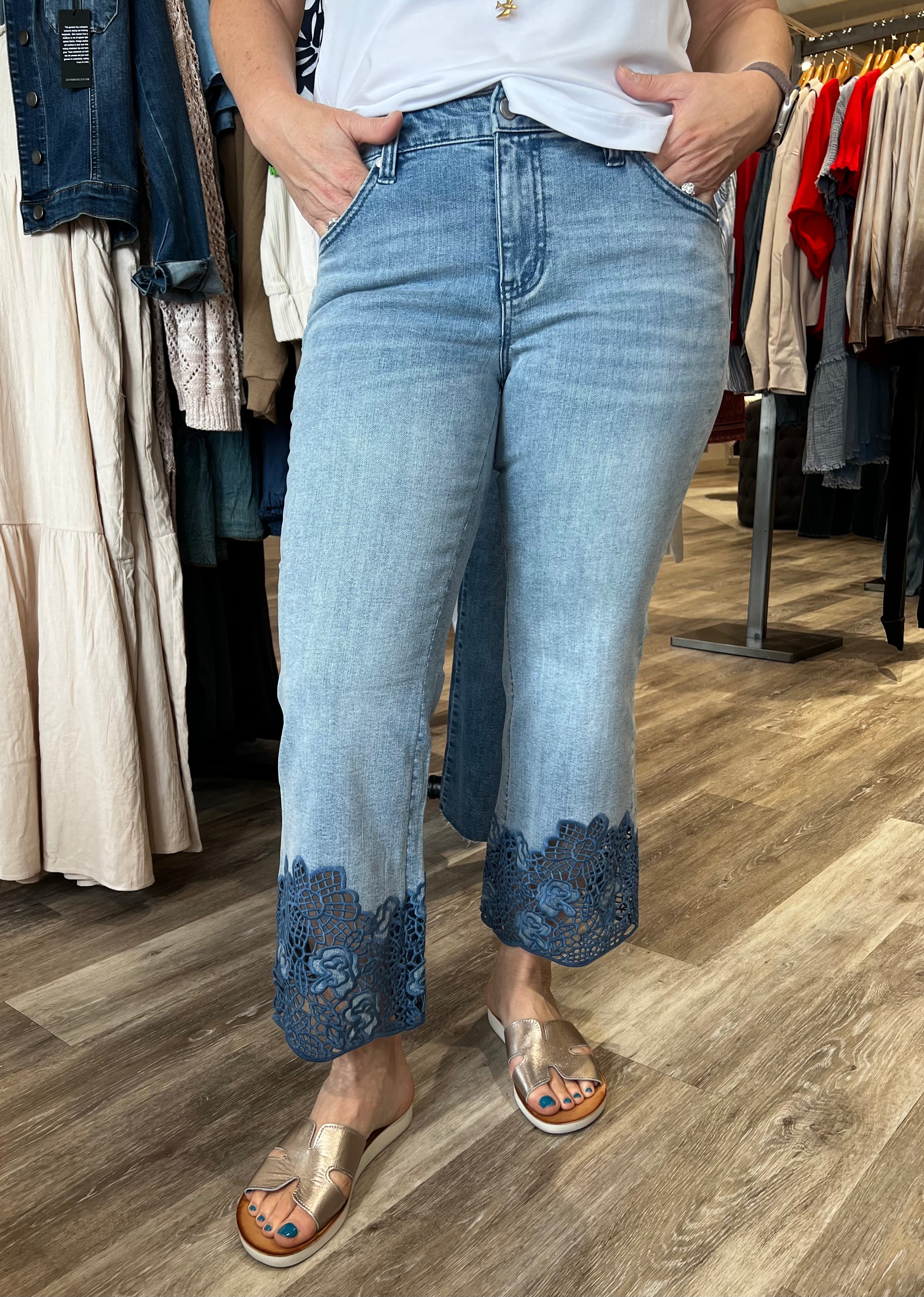 Fall in love with this versatile mid-rise crop, featuring a light wash, flared leg, and embroidered hem. Elevate your look with a lightweight blazer and sandals or keep it casual with a classic tee and sneakers.