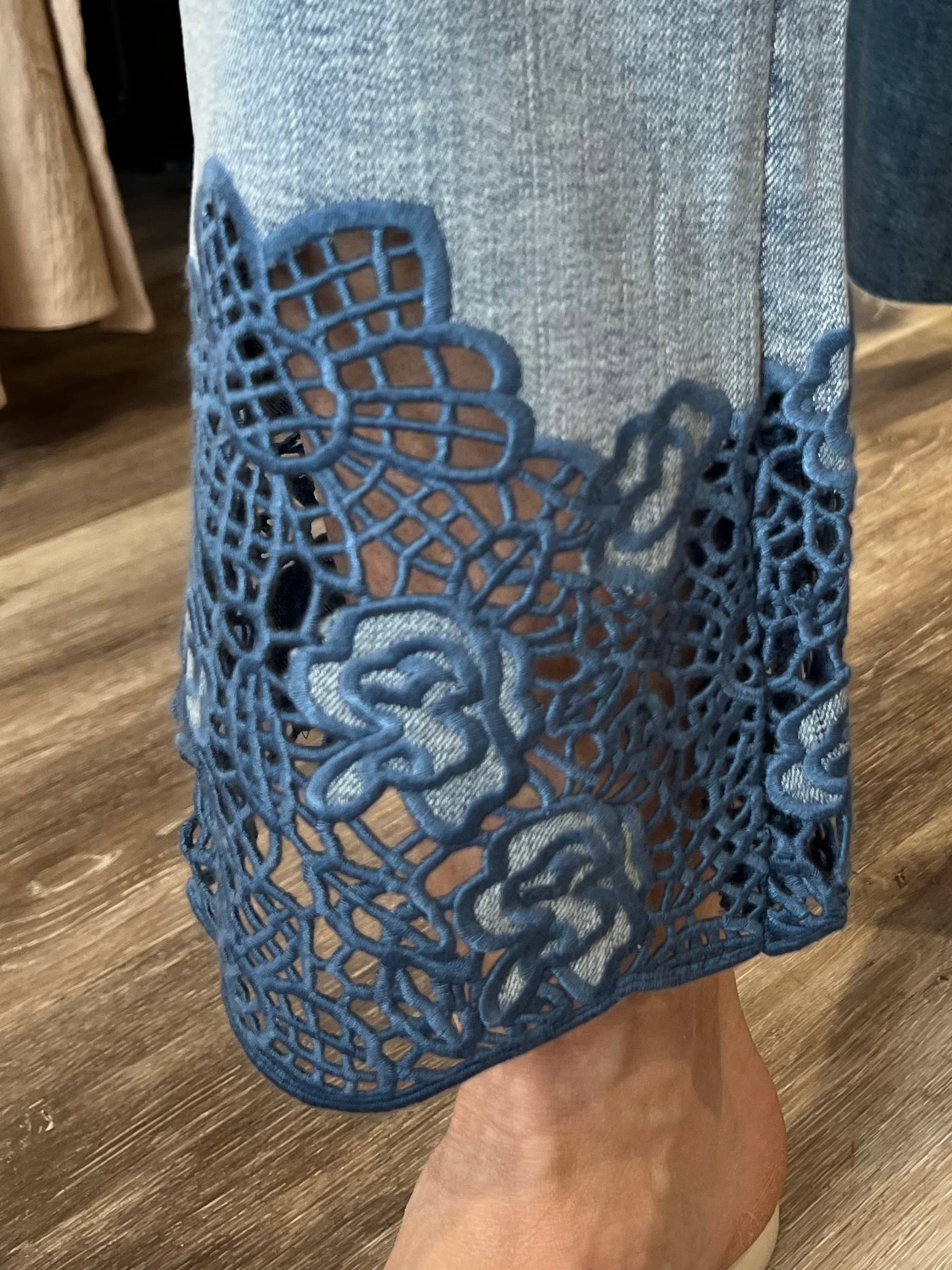 Fall in love with this versatile mid-rise crop, featuring a light wash, flared leg, and embroidered hem. Elevate your look with a lightweight blazer and sandals or keep it casual with a classic tee and sneakers.