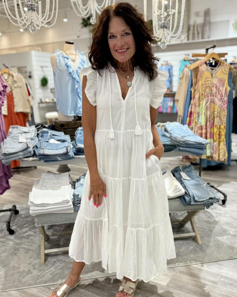 Saunter from beachy dinners to sunset cocktails in this breezy cover-up maxi made with fluttering ruffle sleeves and a flouncy tiered skirt that sways with every step.
52" length
Slips on over head
Split neck with ties
Cap sleeves
Lined
100% cotton
