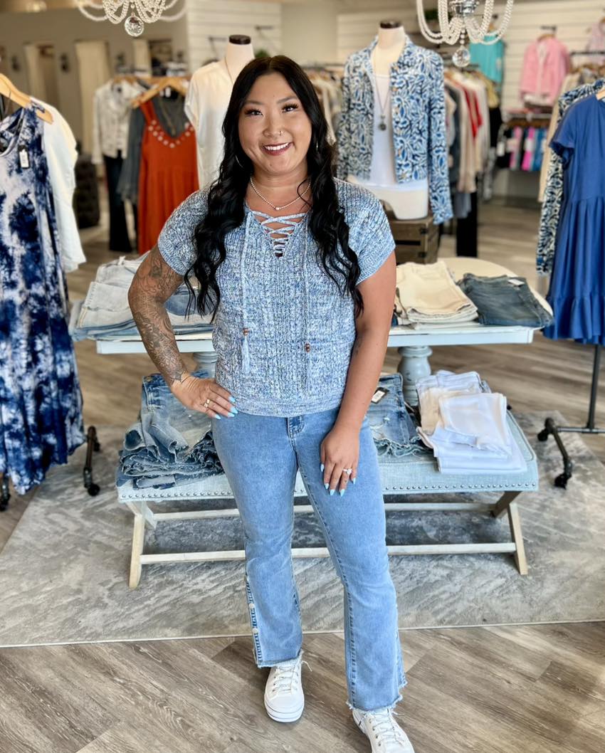 Cozy up in this short-sleeve sweater, showcasing an eye-catching cable-knit design in multicolor yarn. The V-neckline features lace-up detailing, with tie ends adorned in beautiful beads. A boxy fit and extended shoulders create a relaxed feel for effortless comfort. Nautical Blue color