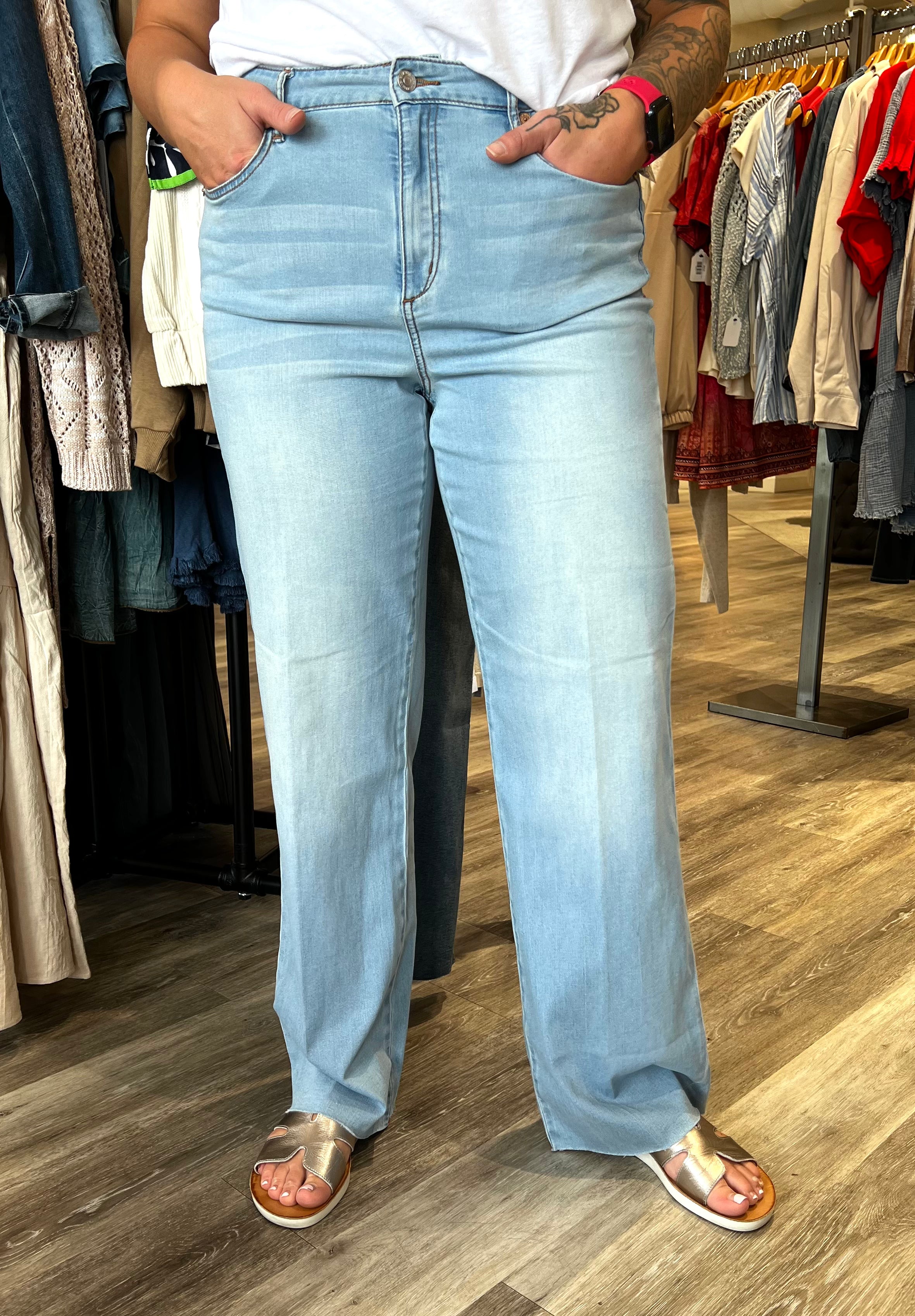Step up your denim game with this pair of wide-leg jeans, featuring a trouser-inspired crease for a touch of sophistication. Crafted from limitless stretch denim, they provide all-day comfort and flexibility, while the figure-hugging upper fit flatters your shape. Five pockets add practical functionality to this stylish design.
