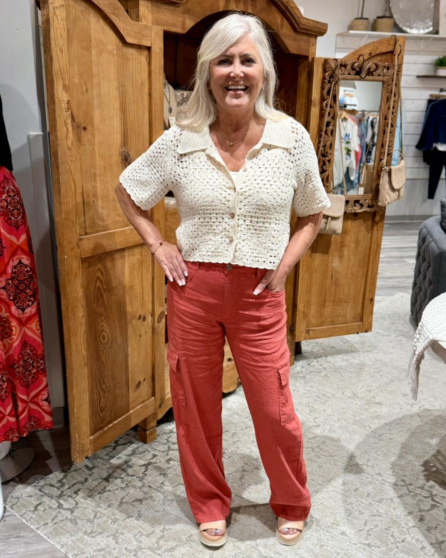 You can pair this comfy top with your favorite dress or bottoms for a super cute look.

Crocheted collar
Wood look buttons
Straight cut
100% Cotton