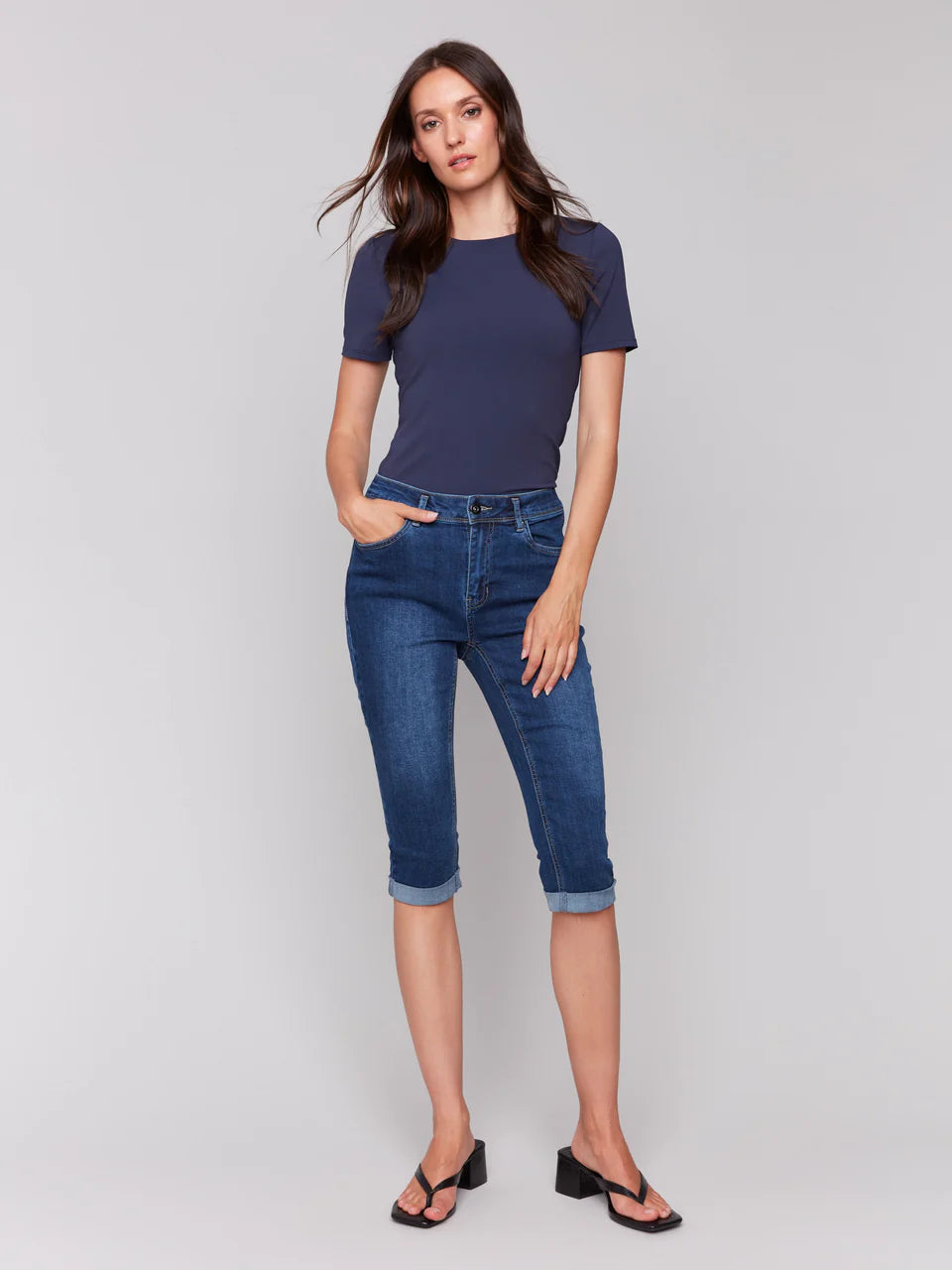 Upgrade your style with these denim pedal pushers! They have a slim leg for a sleek look and a versatile folded hem. The stretchy denim provides comfort and flexibility, while the indigo blue color adds a touch of sophistication. Great for wearing with sandals or sneakers for a cool, casual outfit all spring and summer.

Slim fit
Cropped length
Folded hem
Five-pocket design
Stretch denim
Mid-rise waist