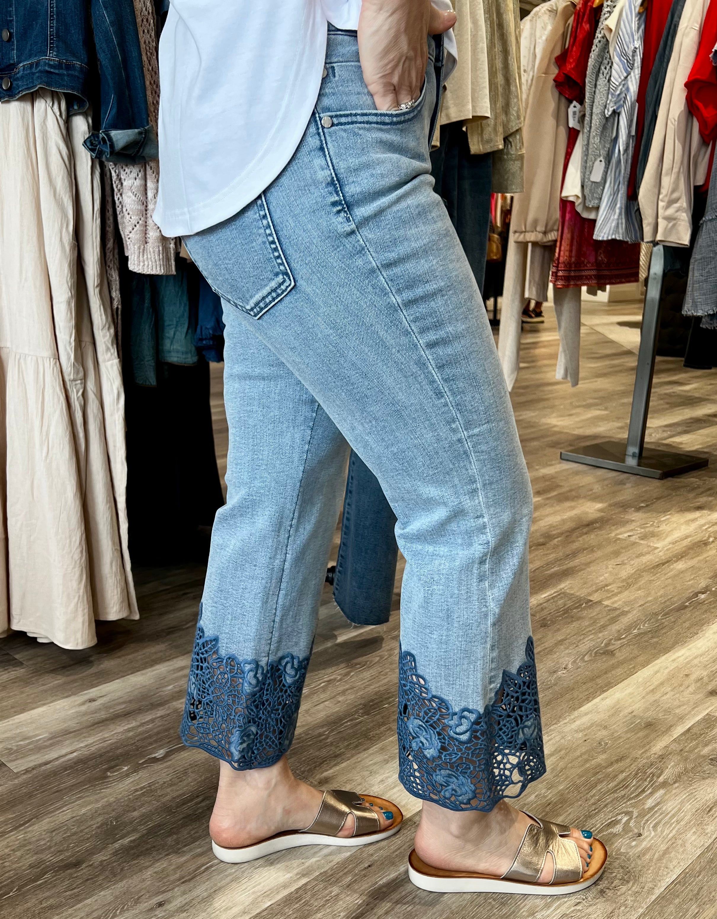 Fall in love with this versatile mid-rise crop, featuring a light wash, flared leg, and embroidered hem. Elevate your look with a lightweight blazer and sandals or keep it casual with a classic tee and sneakers.