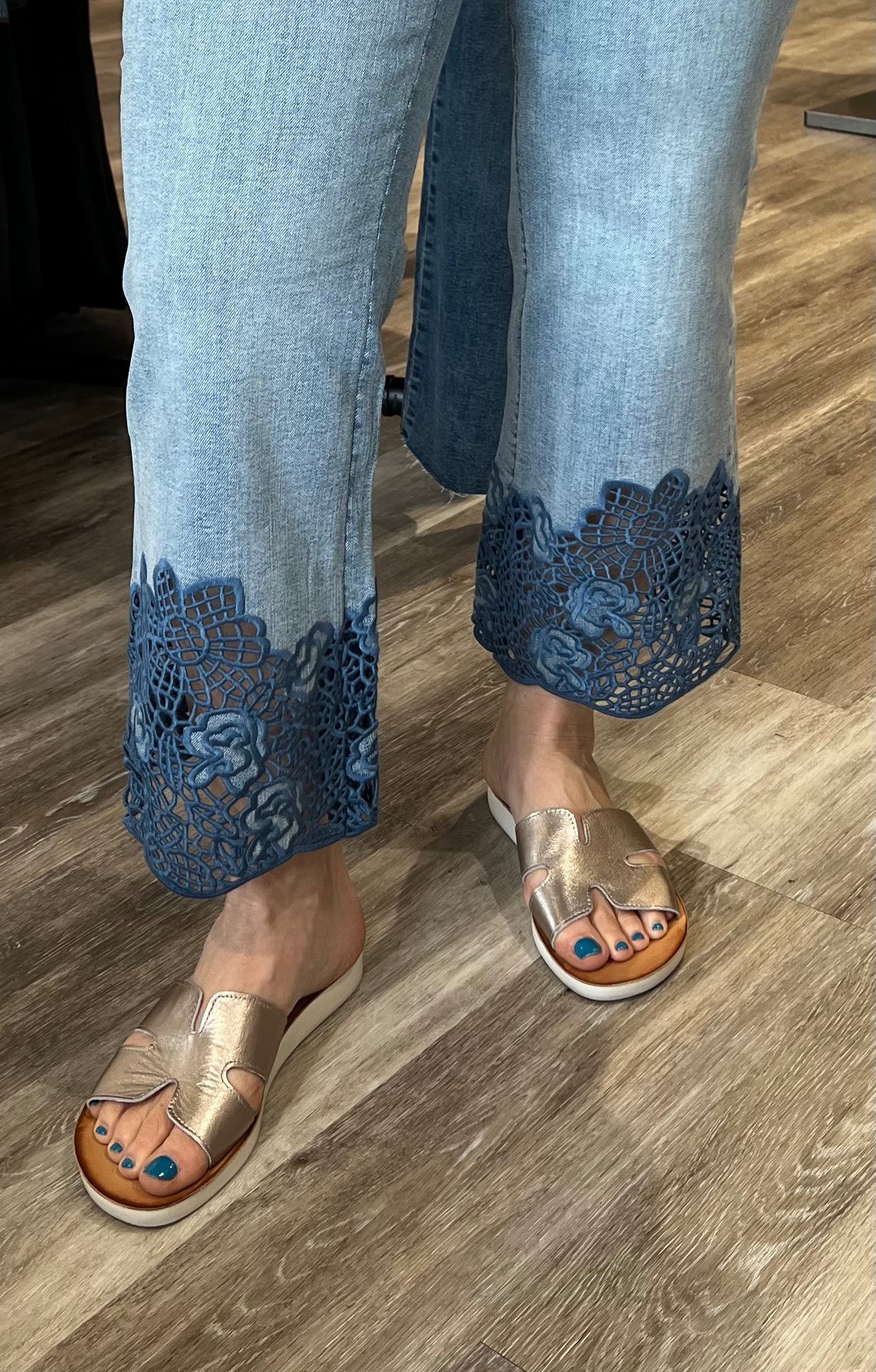 Fall in love with this versatile mid-rise crop, featuring a light wash, flared leg, and embroidered hem. Elevate your look with a lightweight blazer and sandals or keep it casual with a classic tee and sneakers.