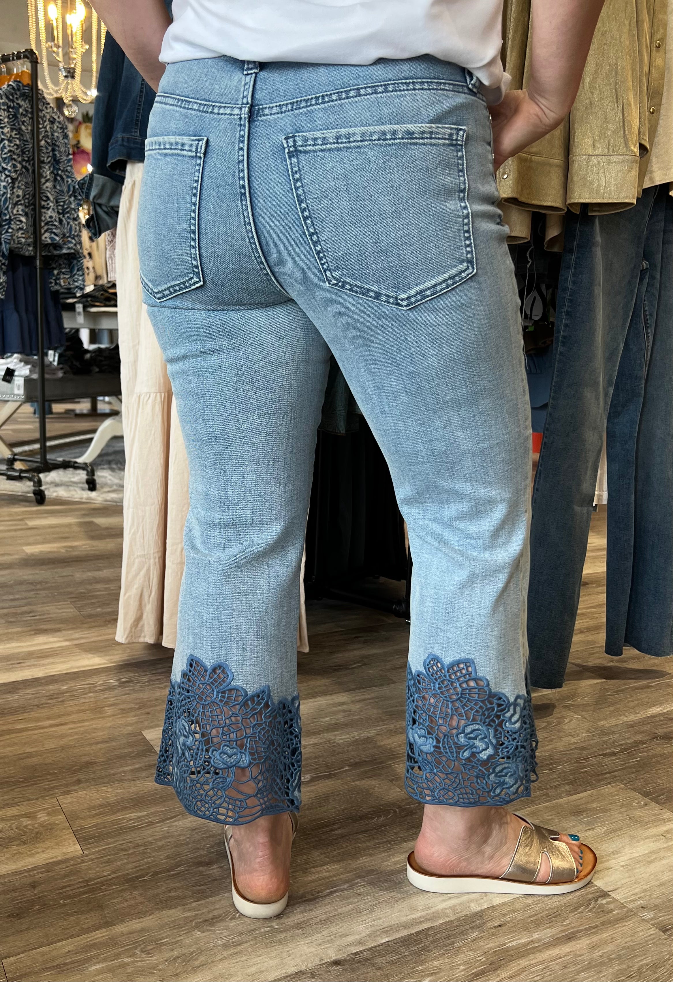 Fall in love with this versatile mid-rise crop, featuring a light wash, flared leg, and embroidered hem. Elevate your look with a lightweight blazer and sandals or keep it casual with a classic tee and sneakers.