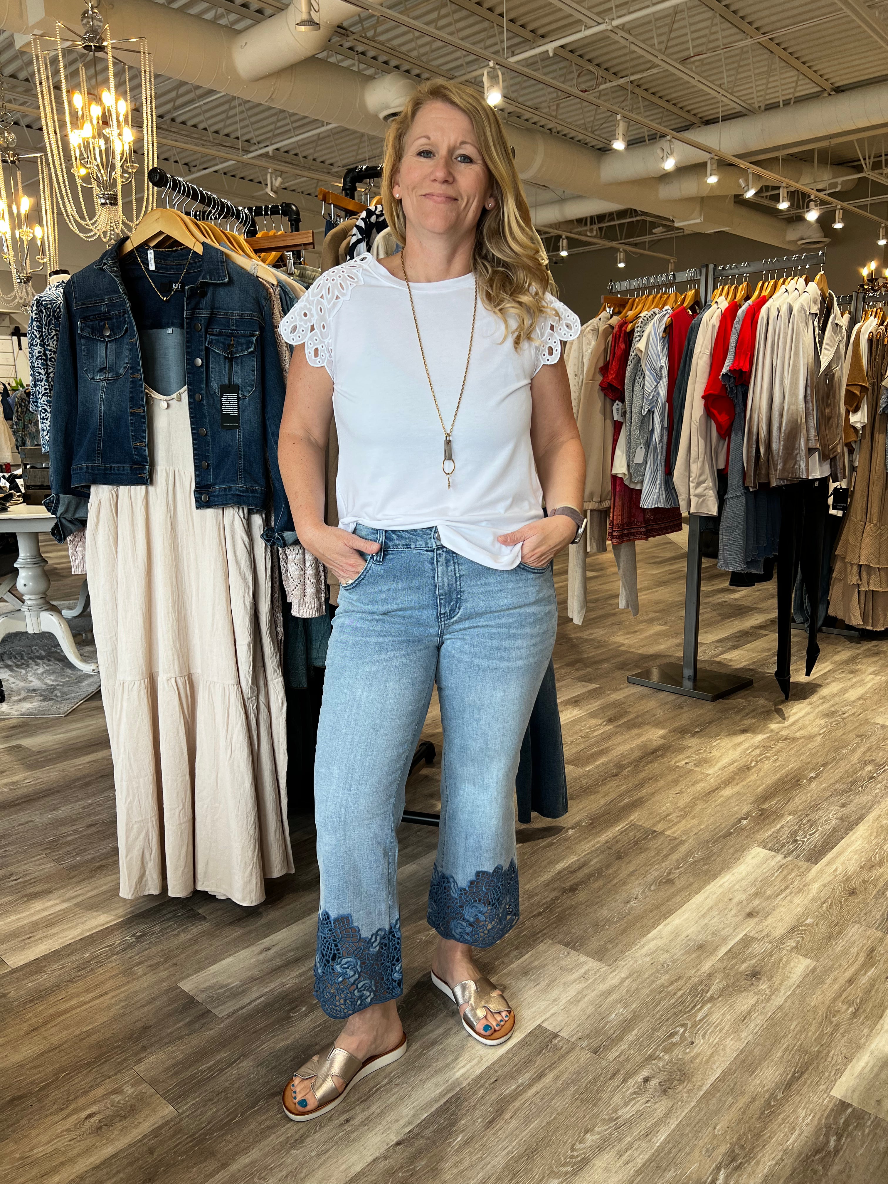 Fall in love with this versatile mid-rise crop, featuring a light wash, flared leg, and embroidered hem. Elevate your look with a lightweight blazer and sandals or keep it casual with a classic tee and sneakers.