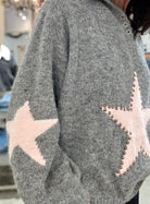 Oversized Star Knit Sweater with Grommet Detail