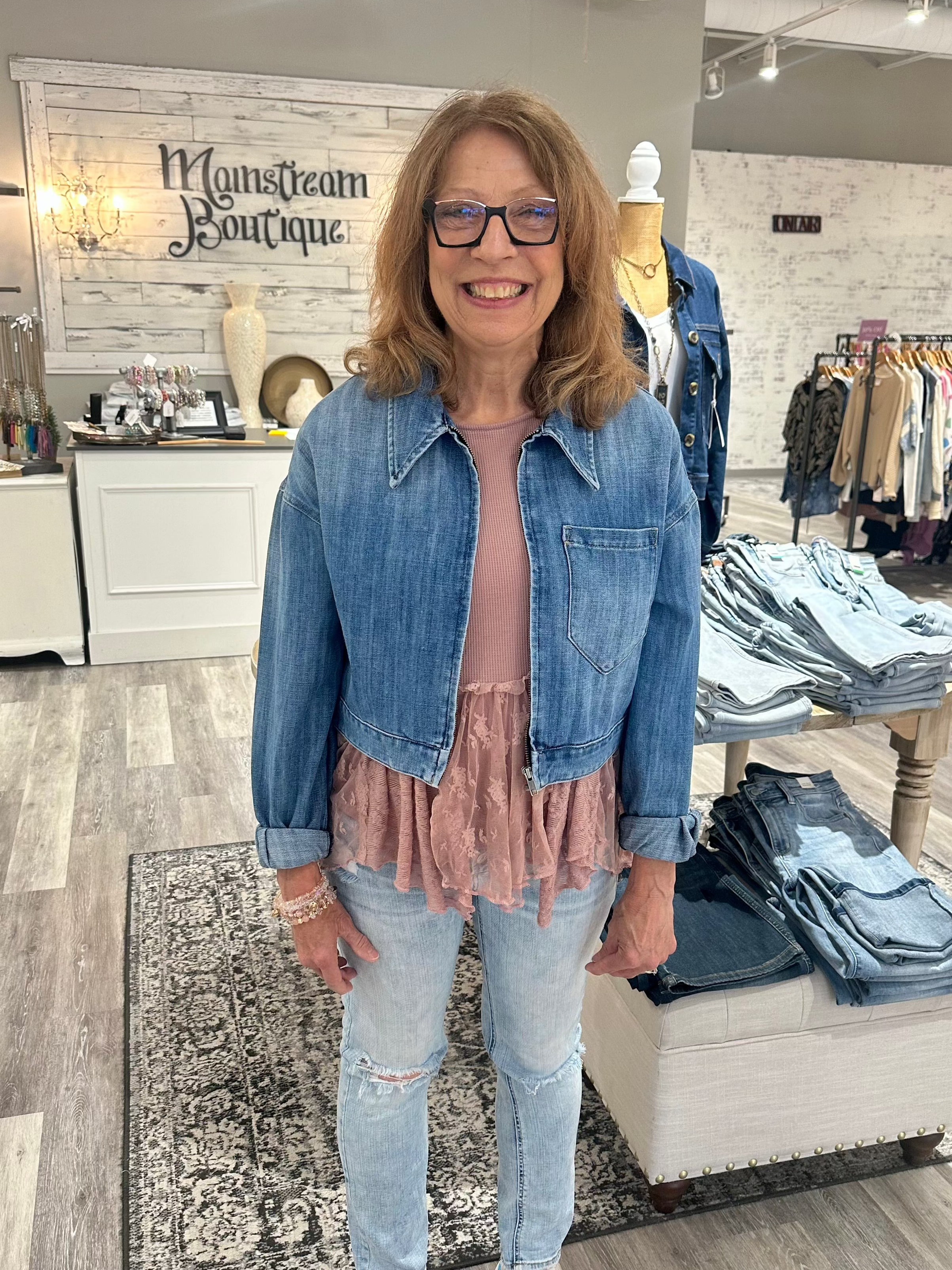 The top collar and long sleeves add a touch of sophistication, while the zip down front and cropped silhouette create a modern, stylish look. The medium wash adds versatility, making this jacket the perfect addition to any wardrobe.

Runs true to size
79% Cotton, 21% Spandex 

