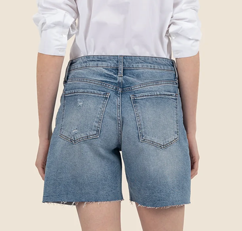 These high rise shorts feature a longer inseam, medium wash, and subtle distressing on the front and back, and raw hem for a stylish, laid back look. Perfect for everyday wear.
Fabric:&nbsp;99% Cotton, 1% Spandex
Size &amp; Fit:&nbsp;Inseam: 6", Leg Opening: 24 3/4", Rise: 10 1/2"
Color:&nbsp;&nbsp;FOCUS W/MED BASE WASH