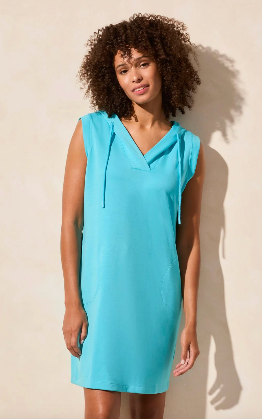 This sleeveless black dress is the epitome of casual sophistication and comfort. Featuring a relaxed fit and a sporty hood with adjustable drawstrings, it blends modern athleisure with classic elegance. The lightweight fabric drapes effortlessly, while the side pockets add both practicality and style. Perfect for dressing up with accessories or keeping it laid-back with sneakers, this versatile piece is a wardrobe essential for any occasion. Aqua