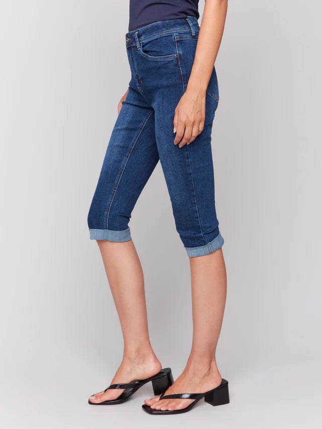 Upgrade your style with these denim pedal pushers! They have a slim leg for a sleek look and a versatile folded hem. The stretchy denim provides comfort and flexibility, while the indigo blue color adds a touch of sophistication. Great for wearing with sandals or sneakers for a cool, casual outfit all spring and summer.

Slim fit
Cropped length
Folded hem
Five-pocket design
Stretch denim
Mid-rise waist